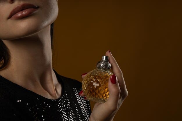 [freepicdownloader.com]-young-woman-applying-perfume-brown-background-space-text-normal